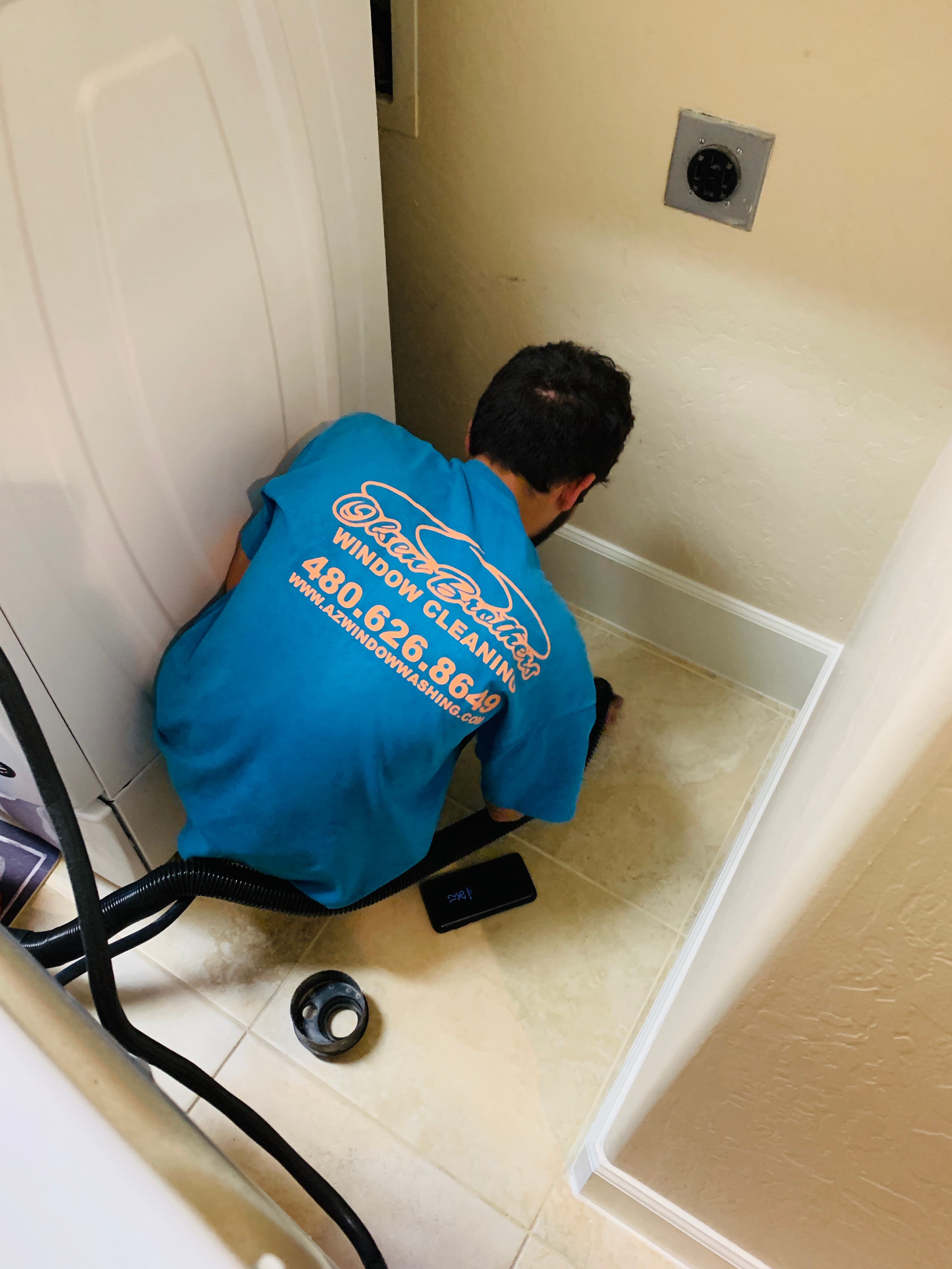 Dryer vent service at a residential home — equipment and crew, Arizona