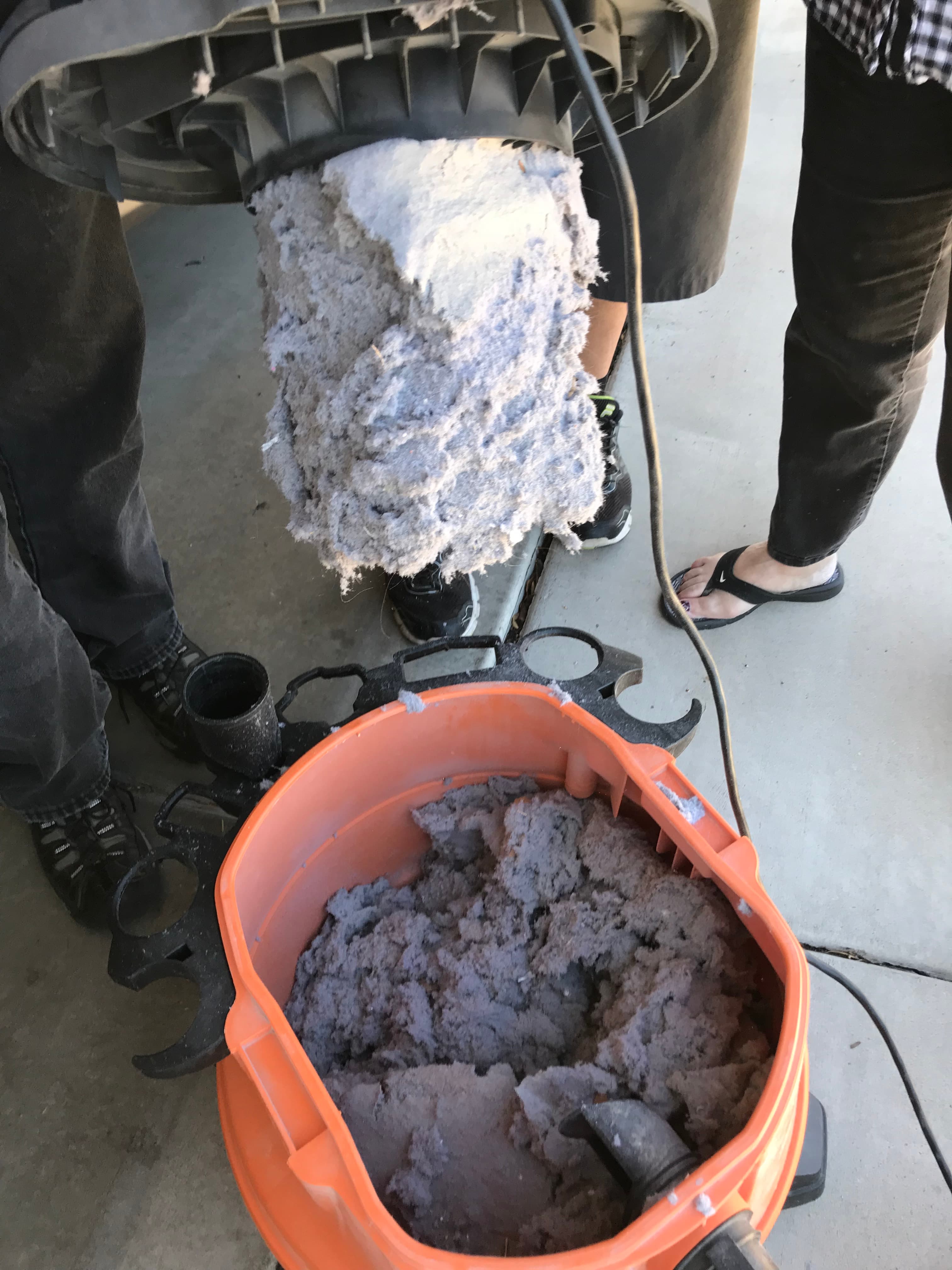 Dryer vent cleaning — large volume of lint removed into a shop vacuum, East Valley Arizona