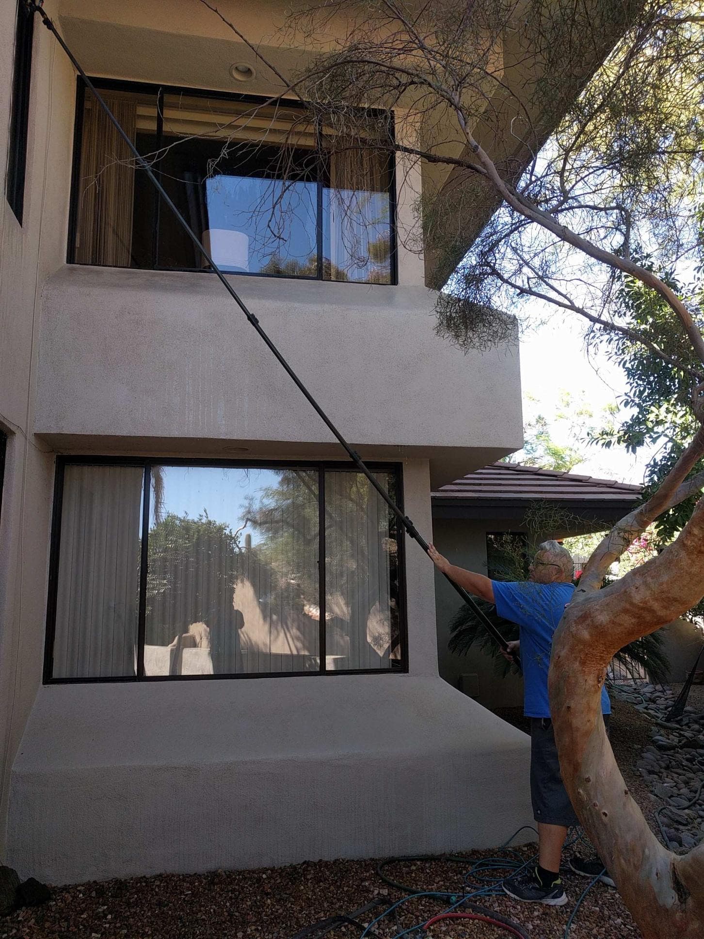Tall exterior glass and framing on an Arizona home — natural light
