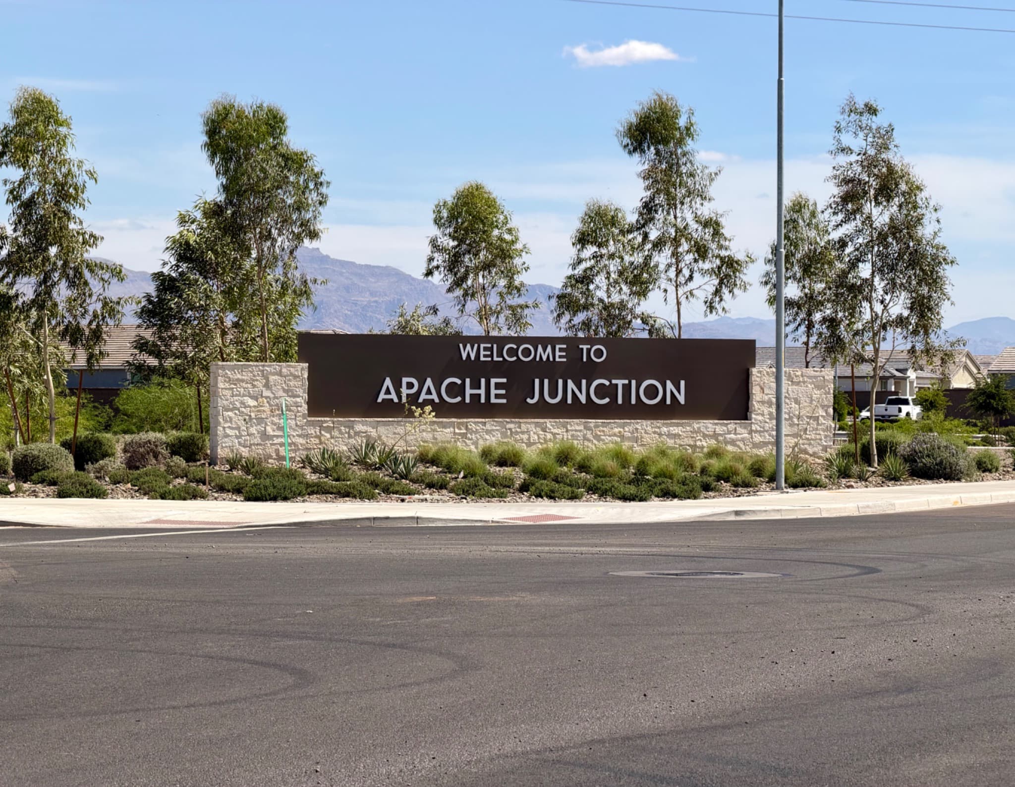Welcome to Apache Junction entry monument with Superstition Mountains behind — Olsen Brothers Window Cleaning service area